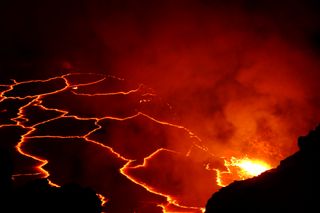 A night view of magma flowing from Hawaii's Kilauea Volcano, considered one of the most active volcanoes on the planet.