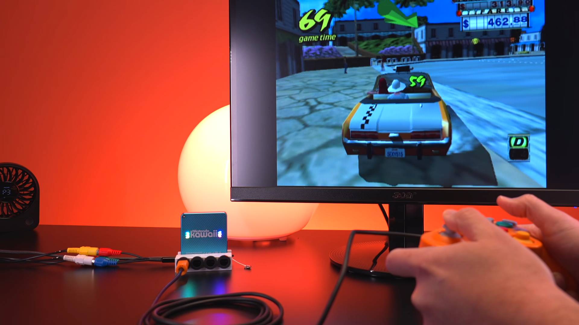 Nintendo Kawaii mini GameCube connected to monitor running Crazy Taxi.