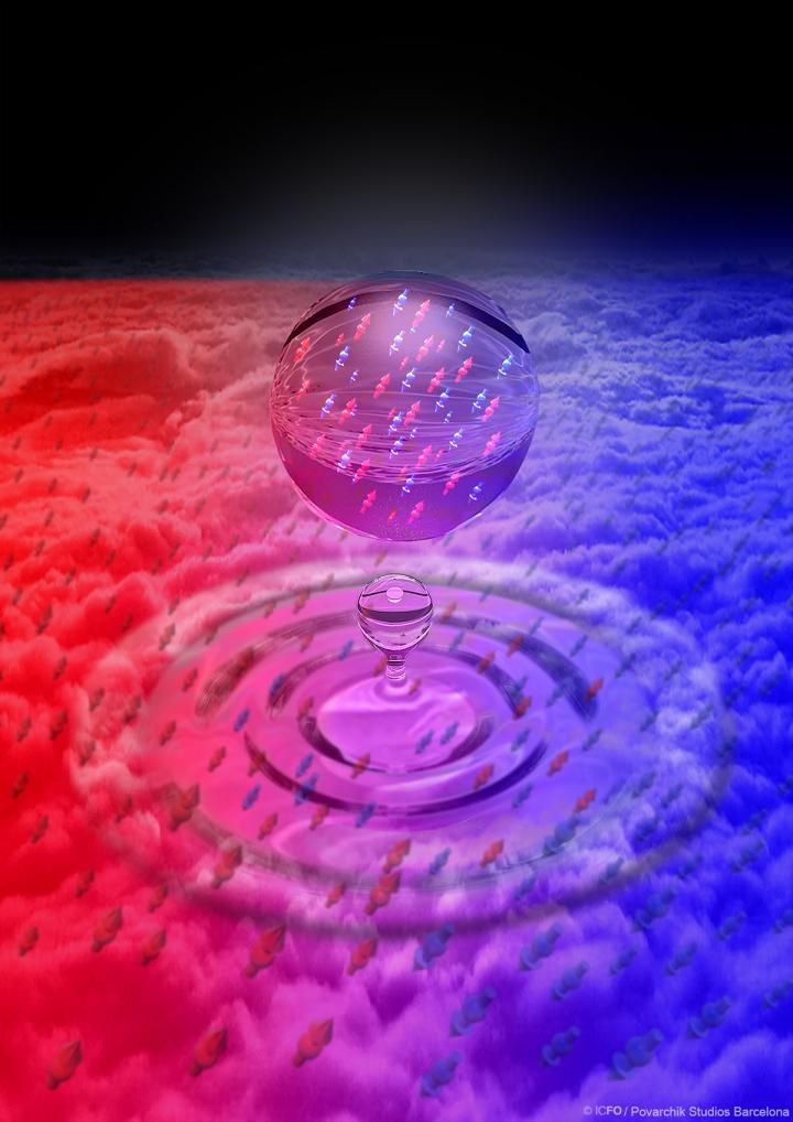 This artist&#039;s rendering depicts a quantum liquid droplet formed by mixing two condensates of ultracold potassium atoms.