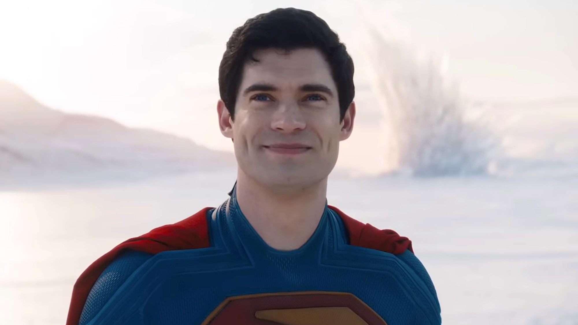 Superman standing and smiling at Kara with Fortress of Solitude behind him in Supergirl