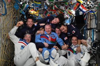 Astronauts on the International Space Station celebrate the olympics