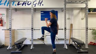 Woman performing a high knees exercise