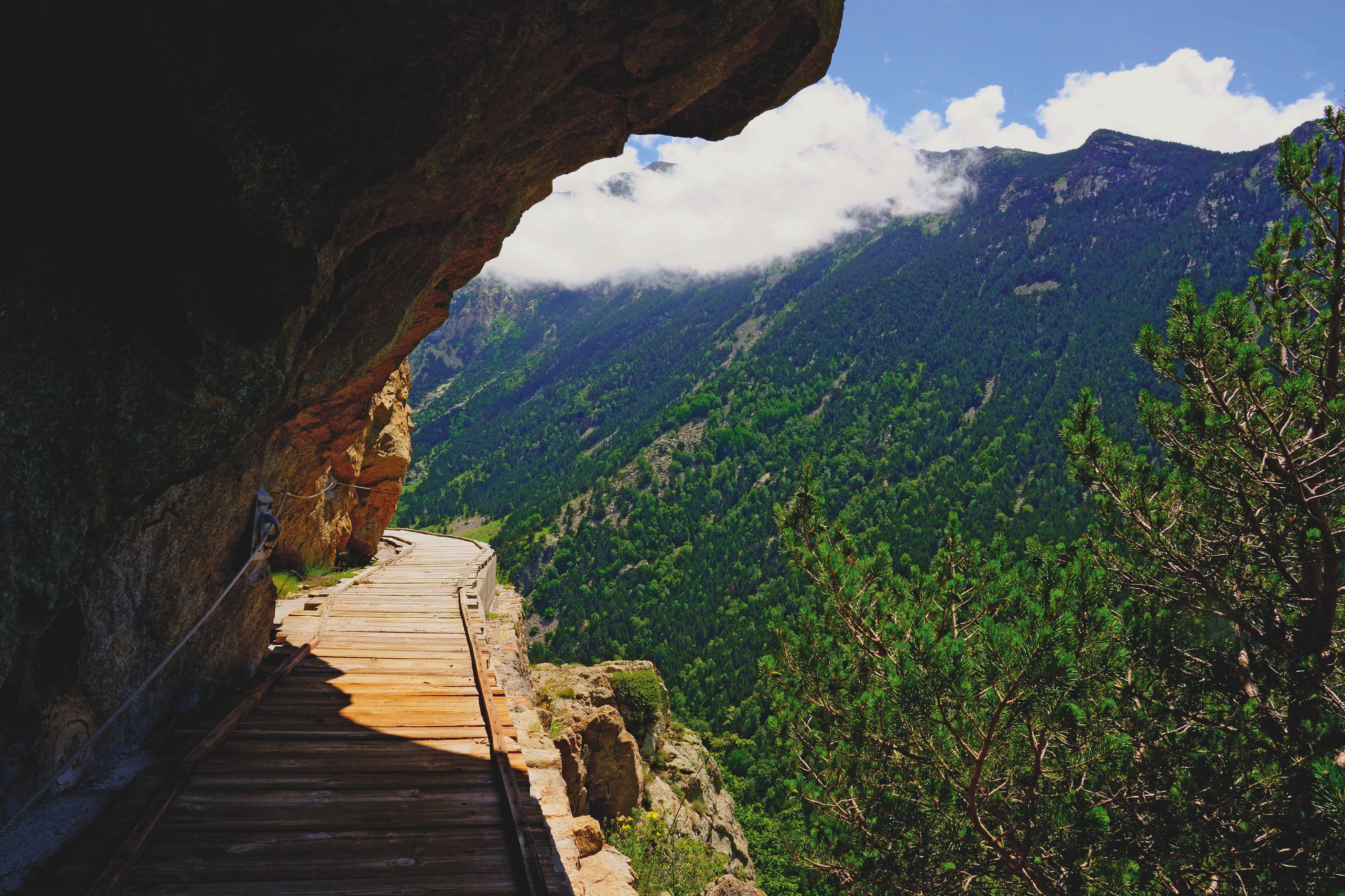 Wood walkway cut into the side of a cliff in the Pyrenees