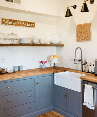 A small kitchen with wooden counter tops