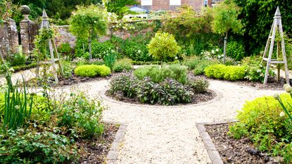 A formal herb or kitchen garden in the grounds of an English country house or manor