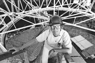Astrophysicist Jill Tarter, shown here on a platform above the Arecibo radio telescope while she was working at NASA's Ames Research Center. Tarter went on to become a leader in the search for intelligent life beyond Earth.