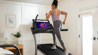 Woman using a NordicTrack treadmill