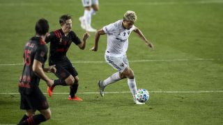 D.C. United's Yamil Asad advances past the New York Red Bulls defense on Sept. 2, 2020. 