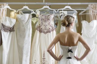 A woman picking a wedding dress