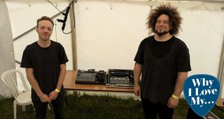 Vower's Joe Gosney (left) and Rabea Massaad pictured inside a tent at ArcTanGent Festival, with their Quad Cortex-driven live rigs on the table behind them.