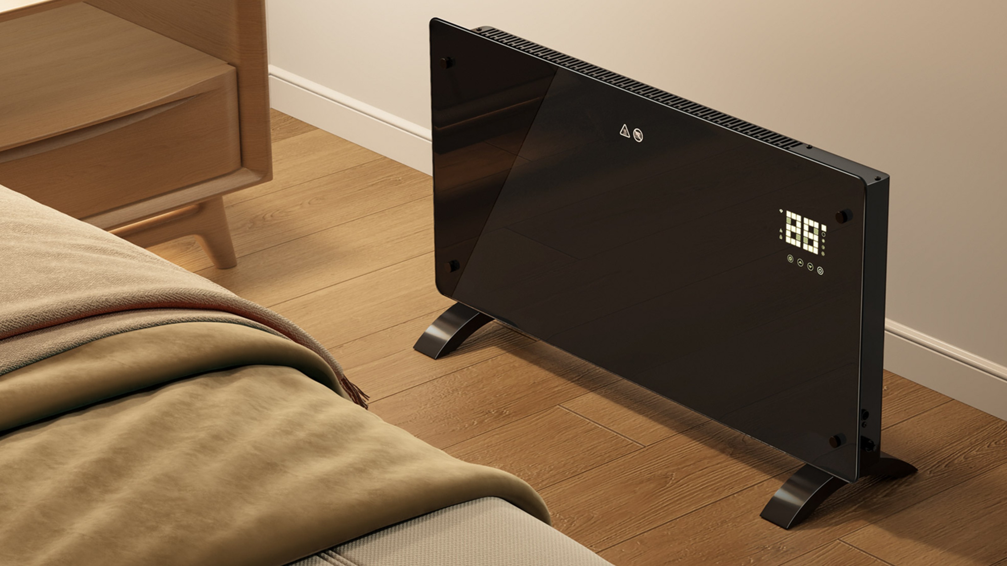 2000W smart panel electric heater from Vonhaus on the floor next to a bedside table in a bedroom