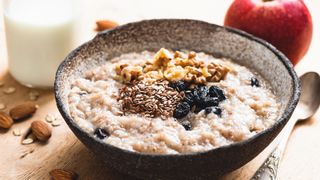 bowl of oats with nuts and raisins