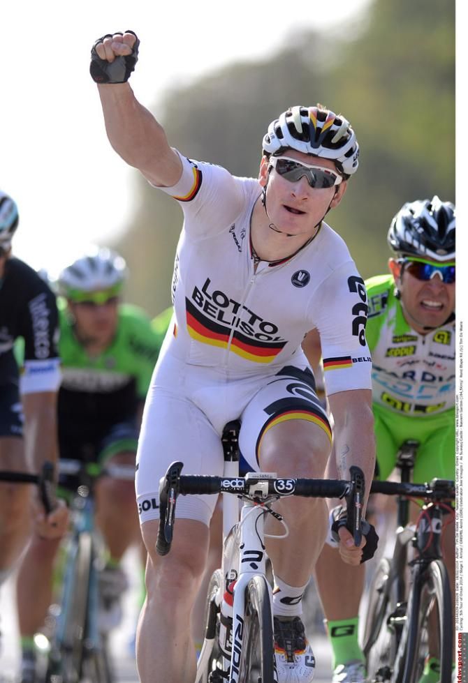 Andre Greipel raises his arm in victory at the opening stage of the Tour of Oman