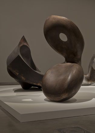 Two abstract objects created from dark wood