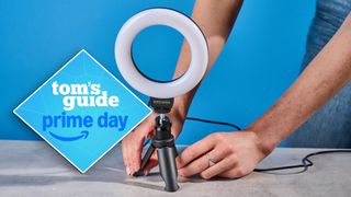 Neewer Basics BR60 5-inch Ring Light photographed in front of a blue background with a prime day tag to the left of the image