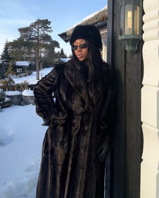 Nnenna Echem in a black fur coat and gloves