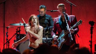 A photograph of Iggy Pop on stage with Josh Homme