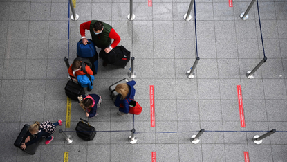 Family queues at airport