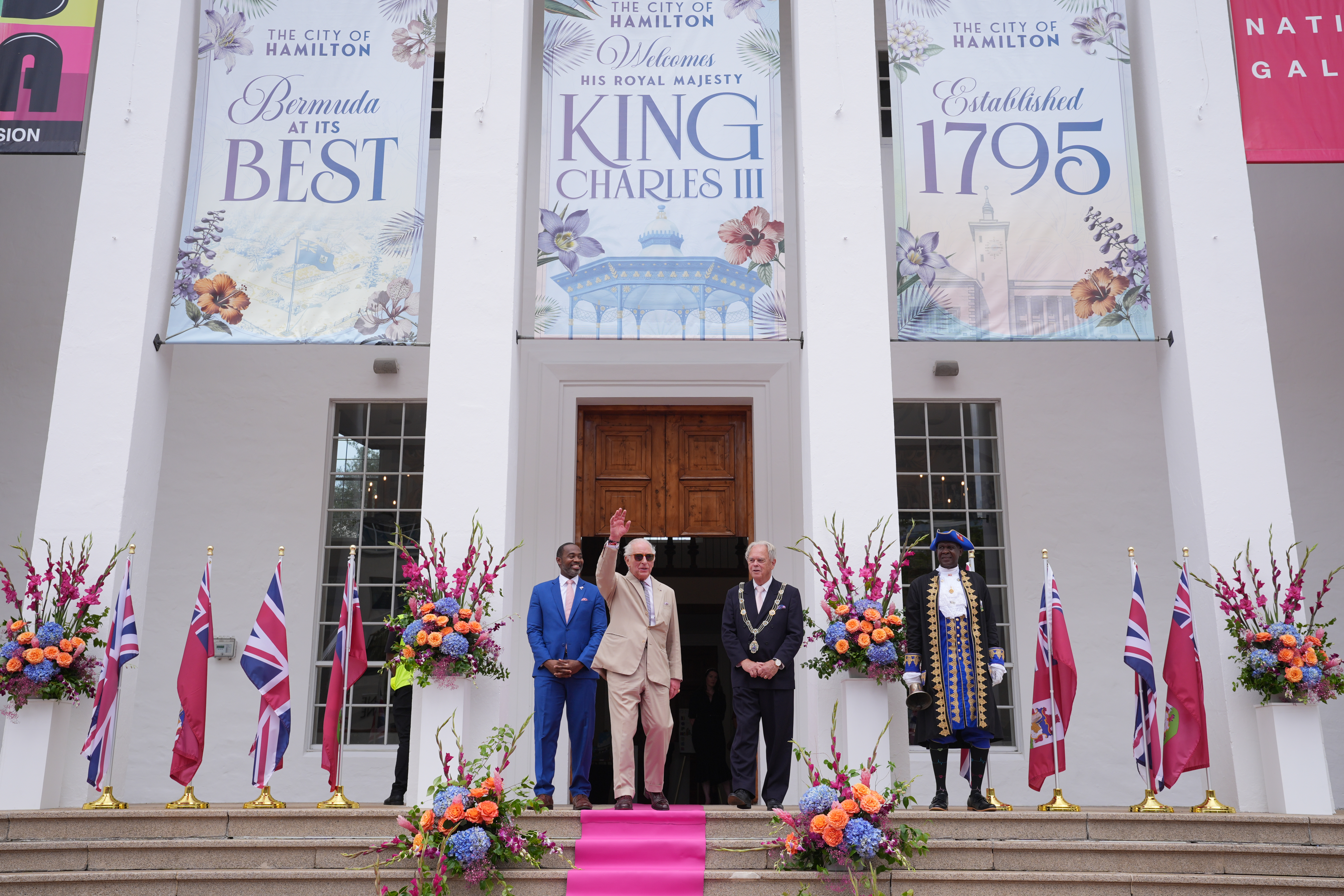King Charles III speaks to well-wishers during a ceremonial welcome at King's Square on May 1, 2026 in St. George's, Bermuda