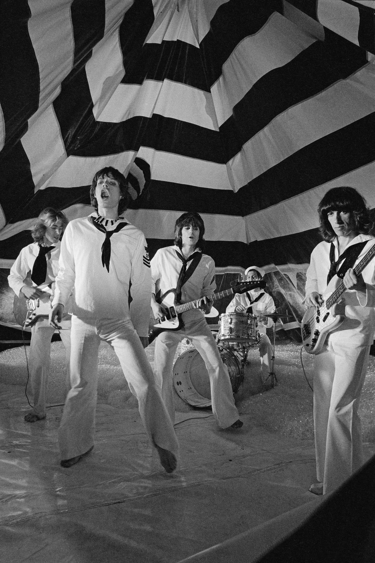 The Rolling Stones pose during the production of their music video for 'It's Only Rock 'n Roll (But I Like It)' in June 1974.