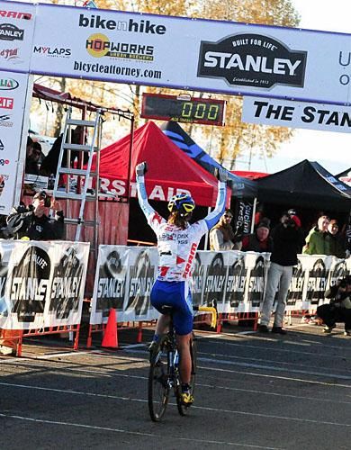 Katerina Nash (Luna Pro Team) celebrating as she rides in alone for the victory.