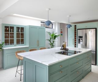 Blue shaker kitchen with gold T-bar handles