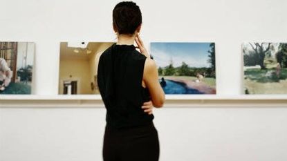 Woman looking at art