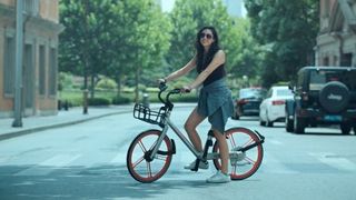 A Girl riding a mobike