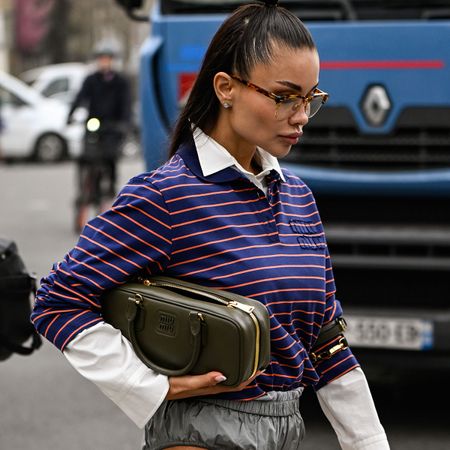 Woman in striped polo and white shirt
