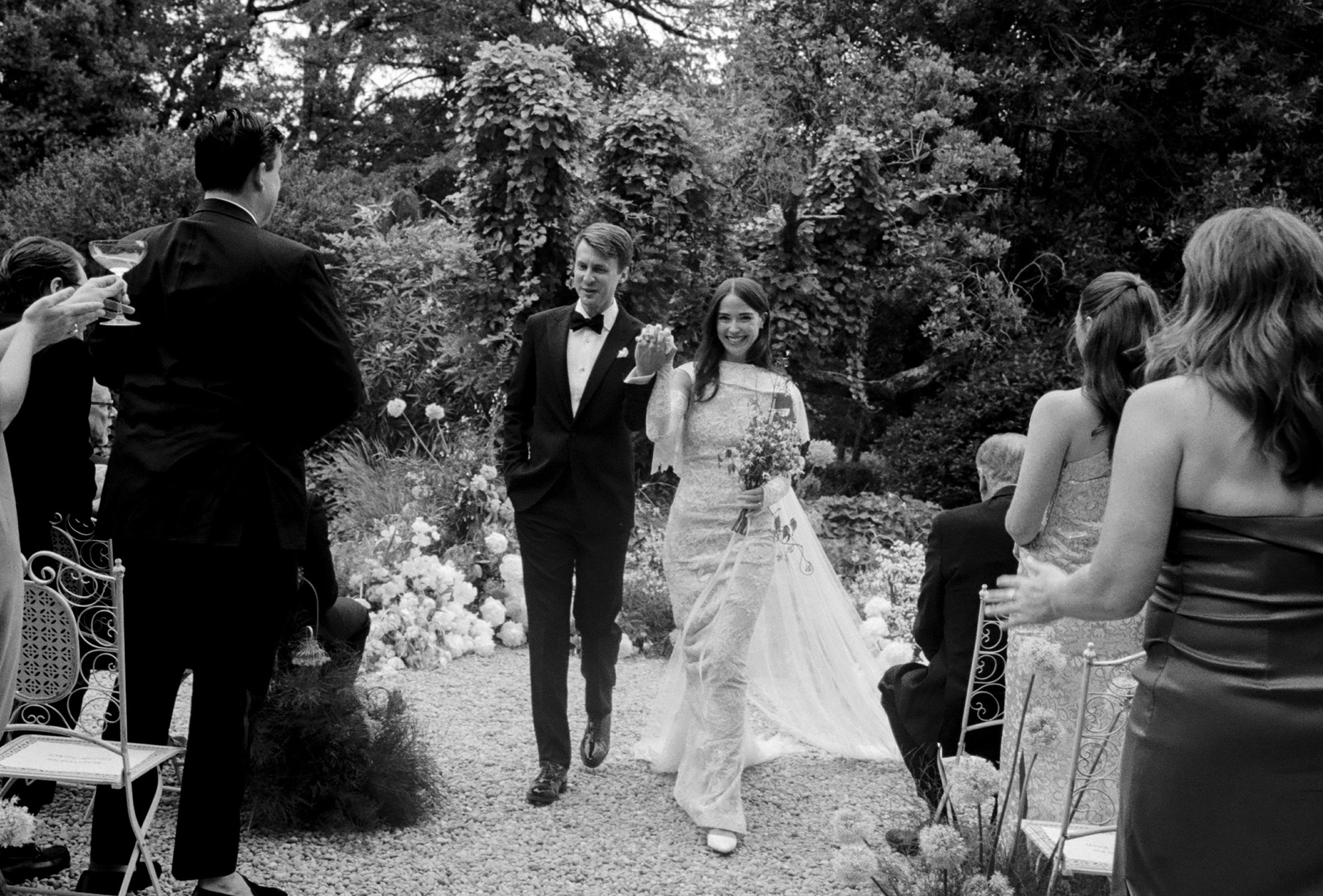 Abbie and Max walking down the aisle after getting married.