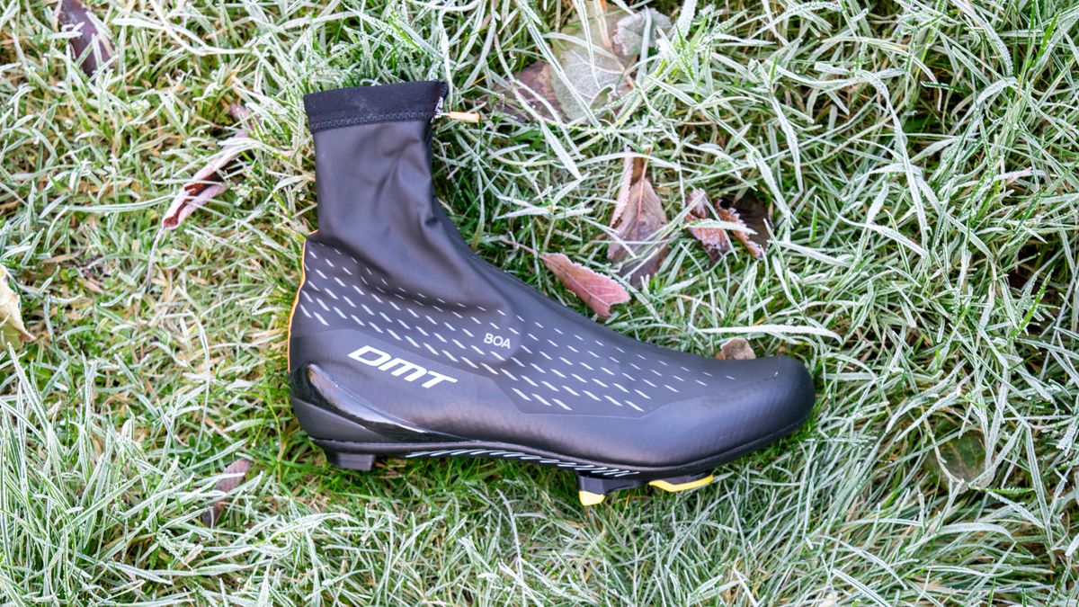 A dirty DMT WKR1 cycling shoe on some frosty grass