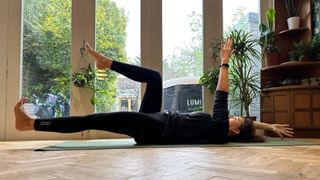 Kerry Law doing deadbugs, one of the best core exercises to do at home