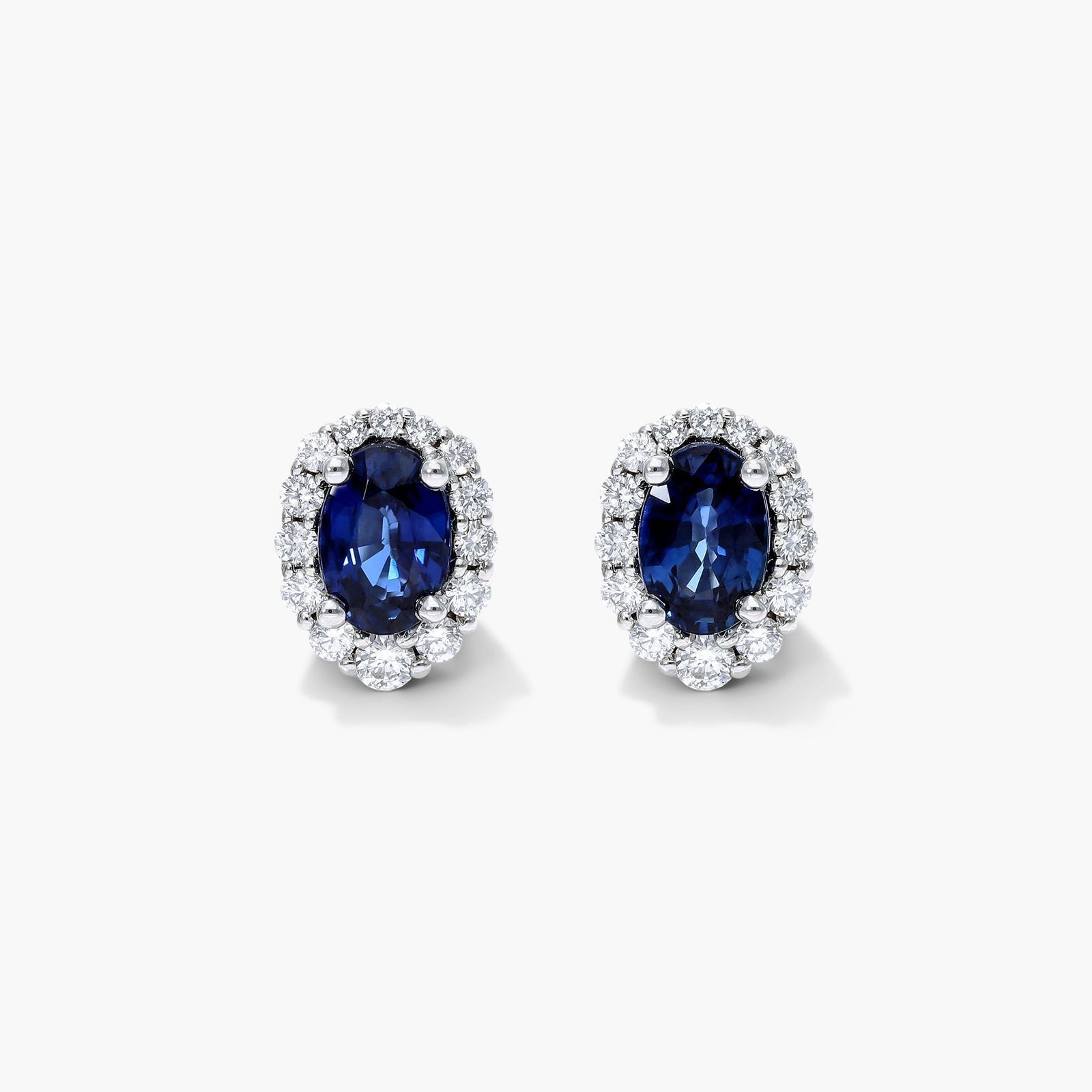 Blue Sapphire and Diamond Halo Earrings in 14k White Gold