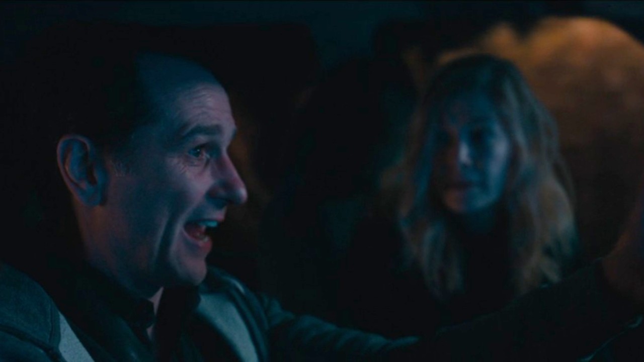 Rosamund Pike talking to Matthew Rhys outside the car in Hallow Road.