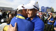 Henrik Stenson hugs a fellow Ryder Cup golfer