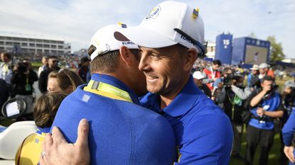 Henrik Stenson hugs a fellow Ryder Cup golfer
