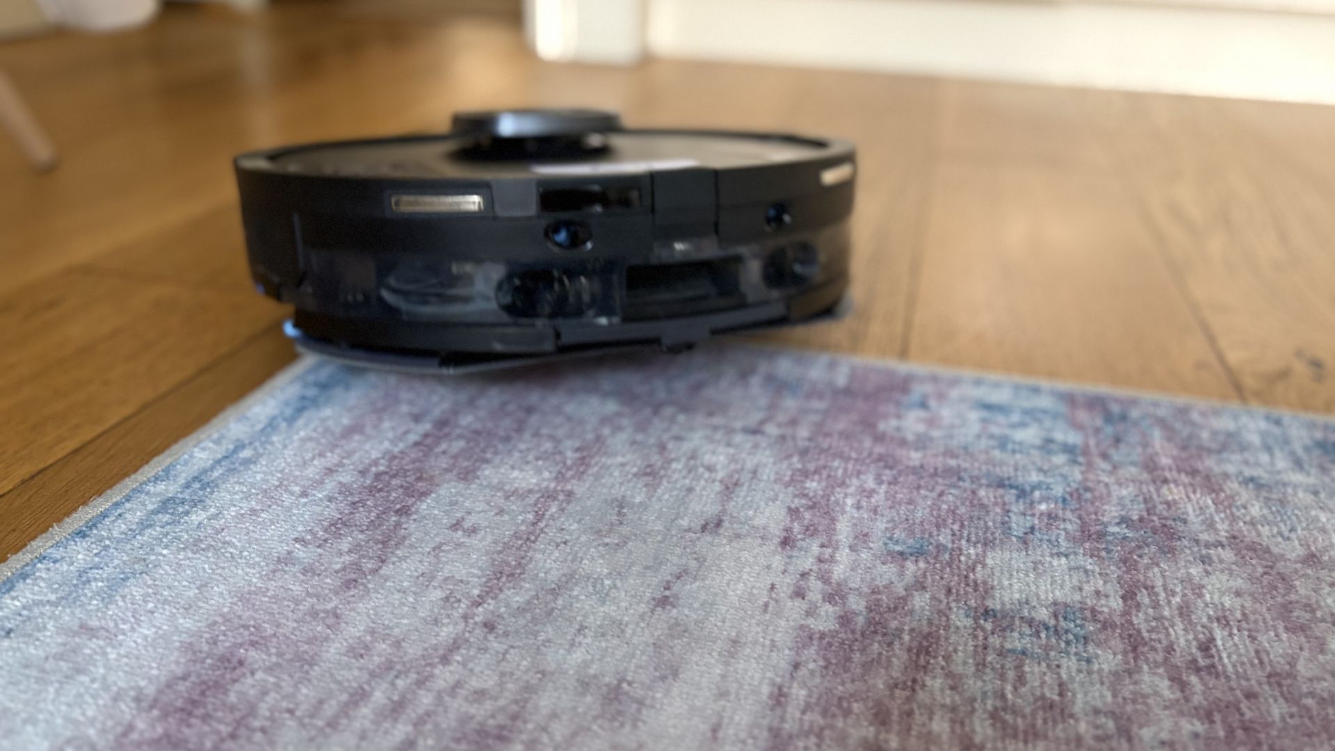 Testing the Shark PowerDetect UV Reveal Robot Vacuum + Mop between the rug and hardwood floor