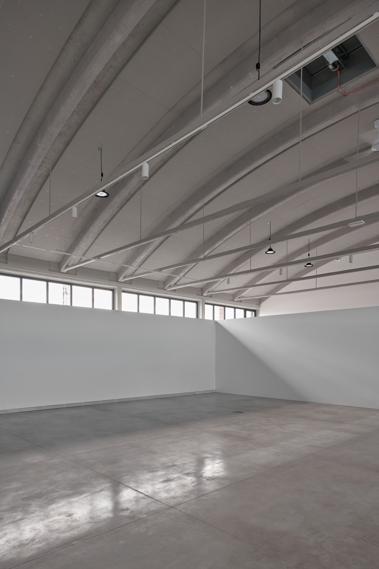 Gallery space showing the original roof and windows