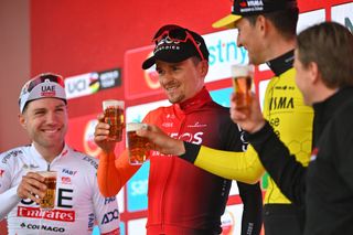 BERG EN TERBLIJT NETHERLANDS APRIL 14 LR Marc Hirschi of Switzerland and UAE Team Emirates on second place race winner Thomas Pidcock of The United Kingdom and Team INEOS Grenadiers and Tiesj Benoot of Belgium and Team Visma Lease a Bike on third place drink beers on the podium ceremony after the 58th Amstel Gold Race 2024 Mens Elite a 2536km one day race from Maastricht to Berg en Terblijt on UCIWT April 14 2024 in Berg en Terblijt Netherlands Photo by Luc ClaessenGetty Images