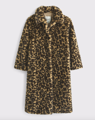 a leopard print coat on a plain backdrop