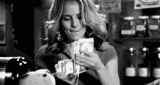 Woman happily counting money