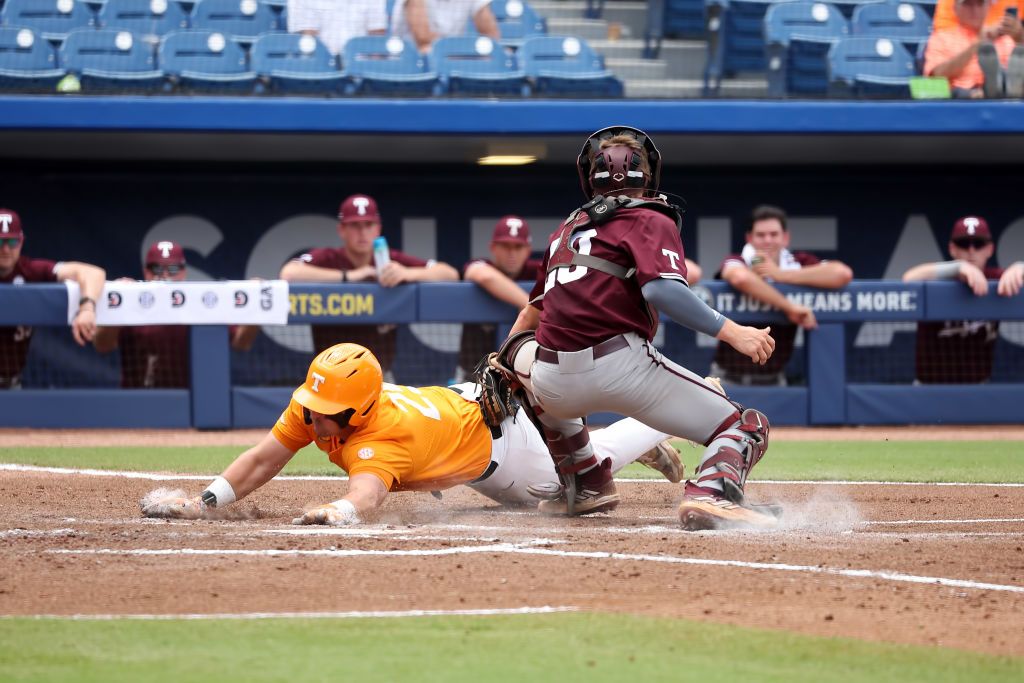 Tennessee Volunteers first baseman Blake Burke (25) slides into home during the 2024 SEC Baseball Tournament game between the Tennessee Volunteers and the Texas A&amp;M Aggies on May 23, 2024 