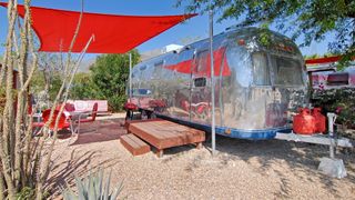A vintage Airstream trailer set up at the Palm Canyon Hotel & RV Resort in Borrego Springs, California