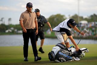 Xander Schauffele walks off the course at the 2024 Players Championship