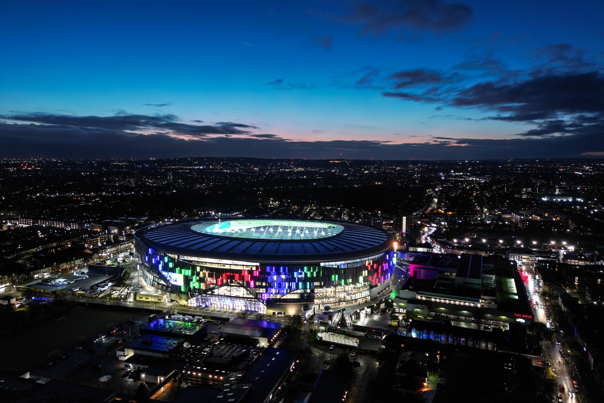 An aerial view as the Tottenham Hotspur Stadium is lit in rainbow colours to celebrate the Rainbow Laces campaign after the Premier League match between Tottenham Hotspur FC and Fulham FC