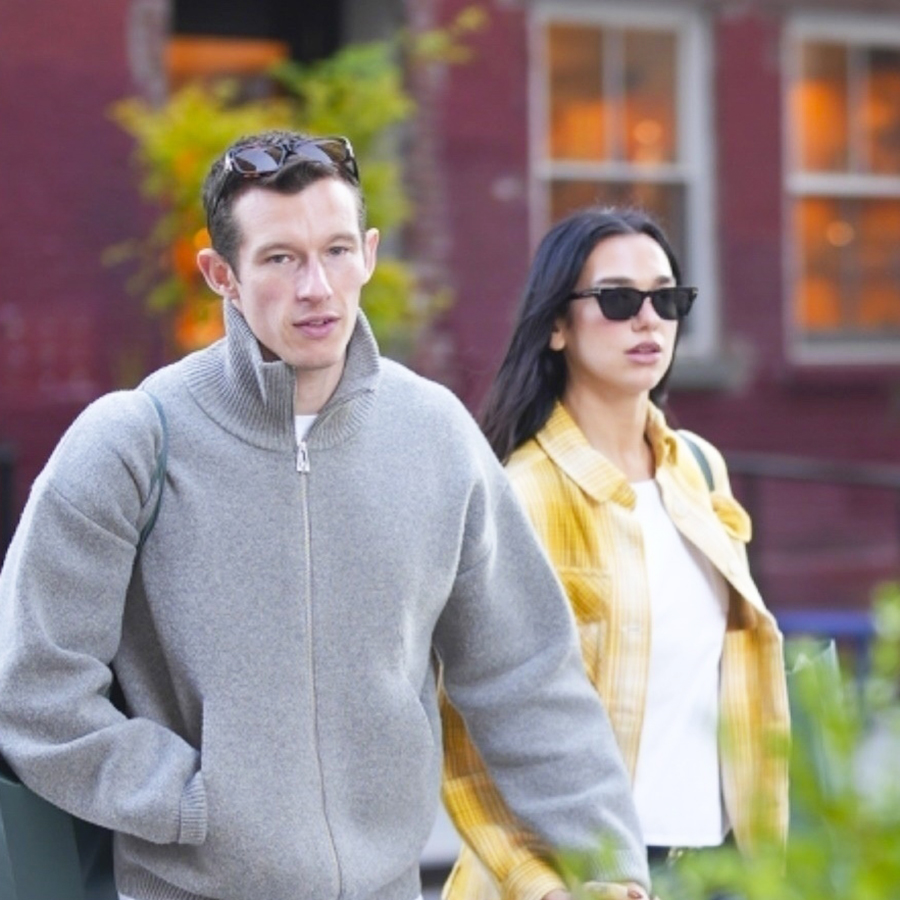 Dua Lipa wearing a yellow plaid shirt and jeans with Callum Turner in NYC