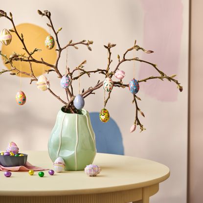 Easter tree with egg decorations against a pastel background