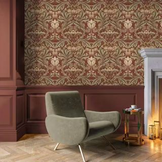 Red and green patterned wallpaper from The Home Depot in a moody living room design