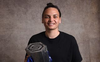 Nicky Evrard of Chelsea poses for a photograph with the Barclays Women's Super League Trophy during a Barclays Women's Super League Winners Photoshoot at Cloud 23 on May 18, 2024 in Manchester, England.