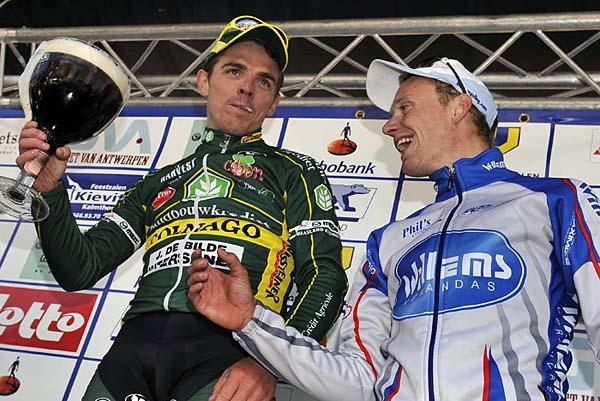 Drink this! Denish Flahaut with James Vanlandschoot on the podium.